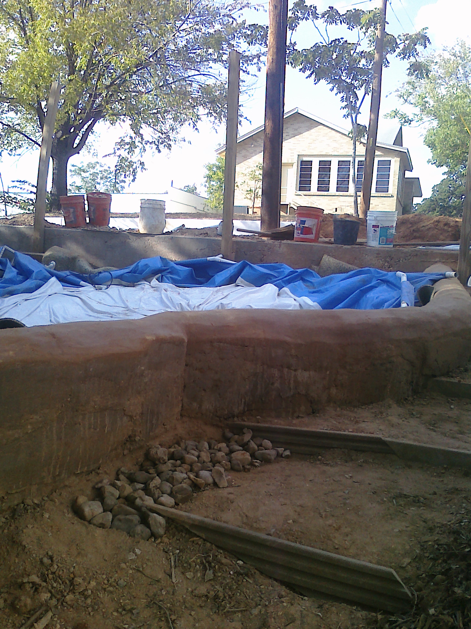 Rain water harvesting to make a bog filtered pool! Nice and clean. Refreshing to cool off in and beautiful to enjoy!